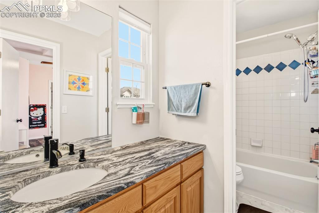 Image 26 of 45: Jack and Jill bathroom between bedroom 2 and 3