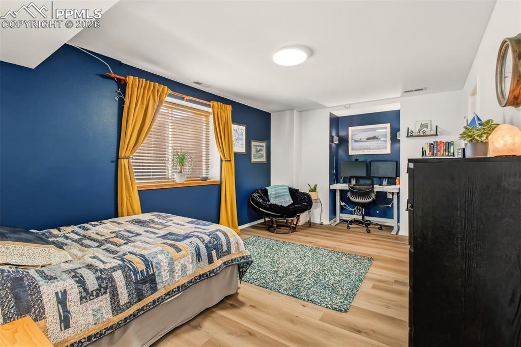 Image 33 of 45: Bedroom 4 with walk in closet and office nook on the lower level