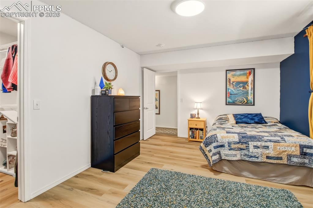 Image 34 of 45: Bedroom 4 with walk in closet and office nook on the lower level