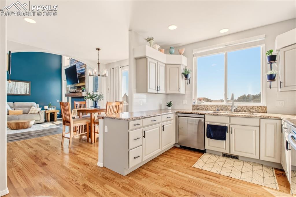 Image 8 of 45: Kitchen with stainless appliances, granite counter tops, walk in pantry and