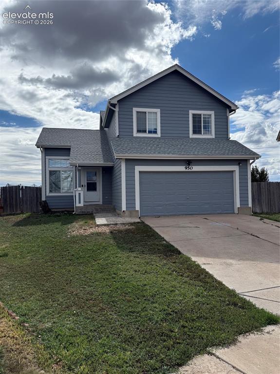 Image 2 of 21: Two-story residence with blue siding and white trim
