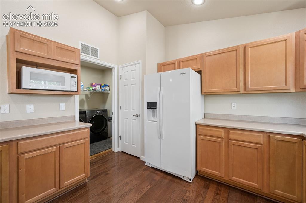 Image 13 of 37: Kitchen into laundry room