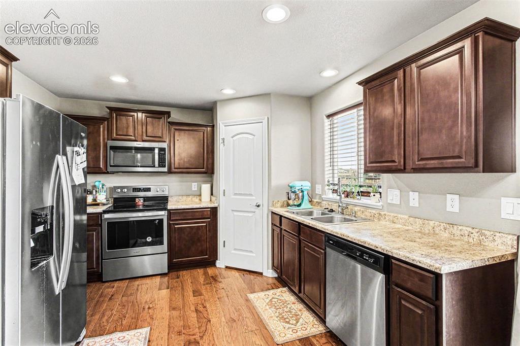 Image 11 of 27: Carpeted room featuring a ceiling fan with integrated lighting, a single wi