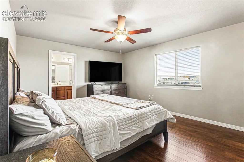 Image 16 of 27: Kitchen featuring wood-finish flooring, recessed lighting, rich wood cabine