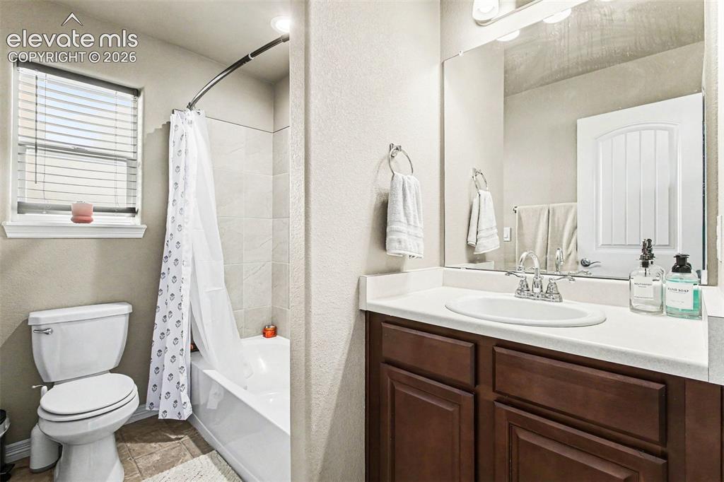 Image 19 of 27: Bedroom featuring wood-finish flooring, a ceiling fan with integrated light