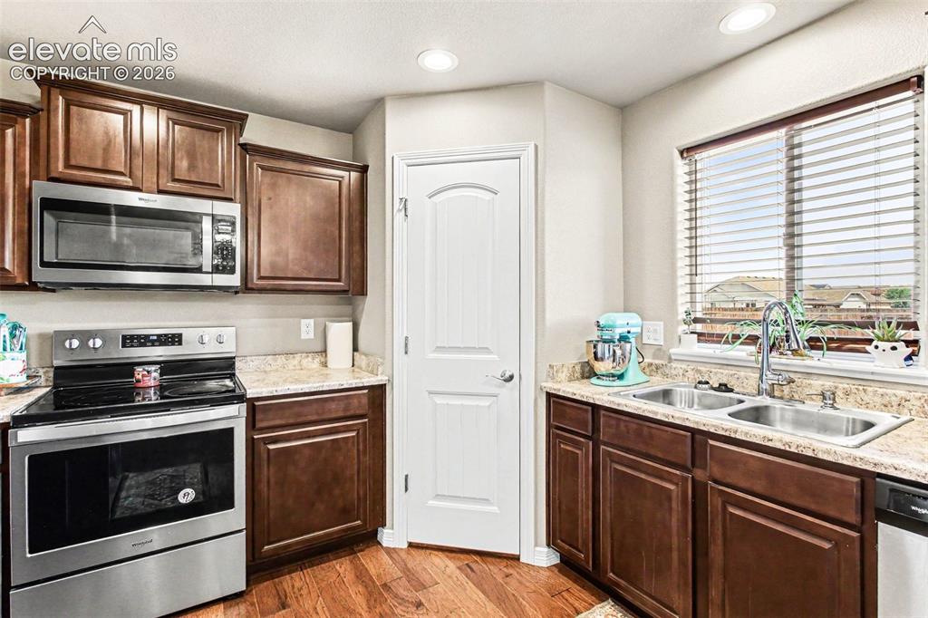 Image 9 of 27: Carpeted interior space featuring a ceiling fan with integrated lighting, a