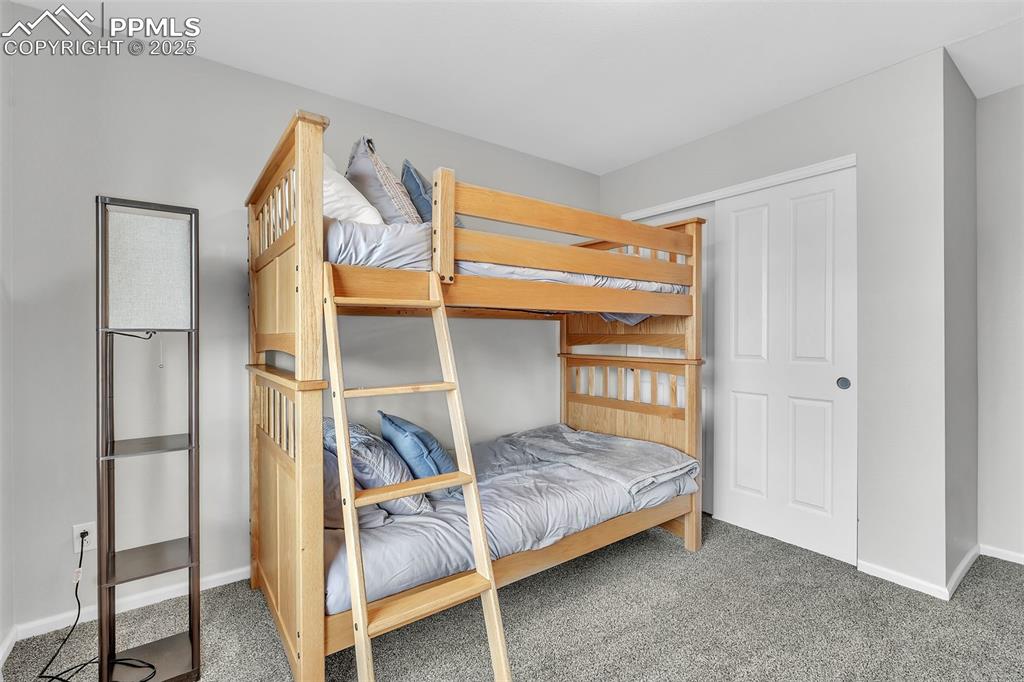 Image 17 of 50: Bedroom featuring carpet floors and baseboards