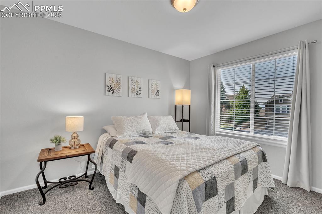 Image 19 of 50: Carpeted bedroom featuring baseboards