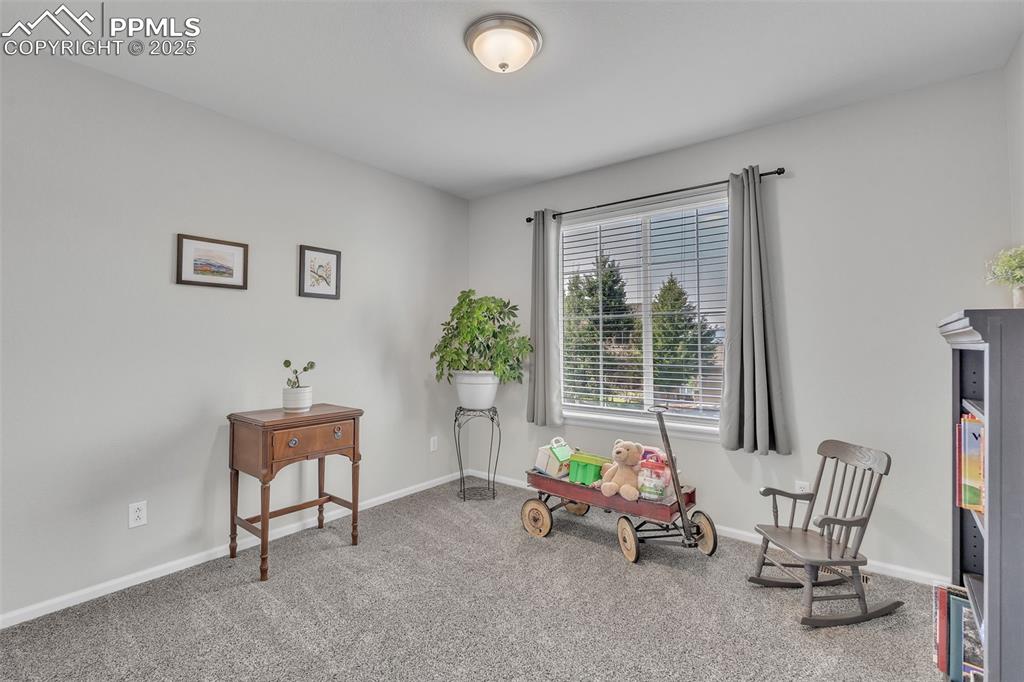 Image 21 of 50: Sitting room featuring carpet flooring and baseboards