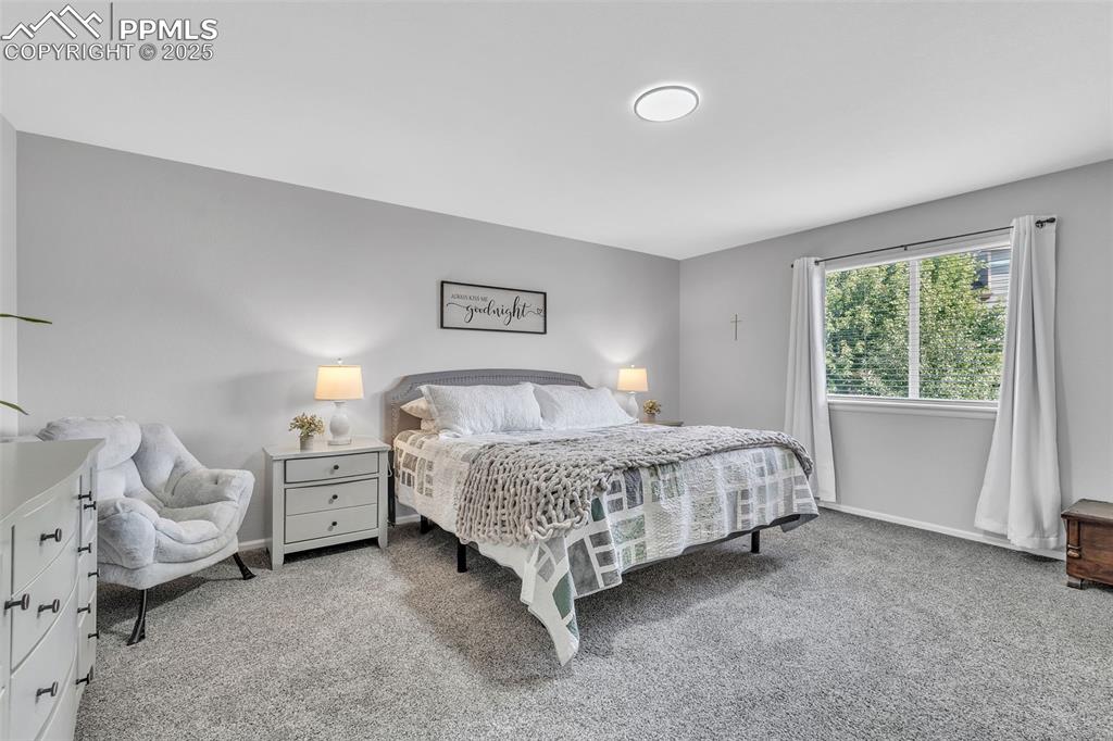 Image 23 of 50: Carpeted bedroom featuring baseboards