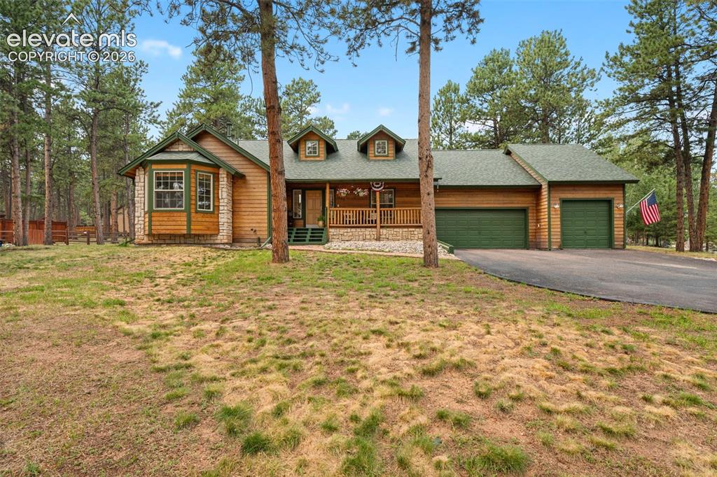 Caption: 4 bed 3 bath home with inviting front porch and moutain home appeal