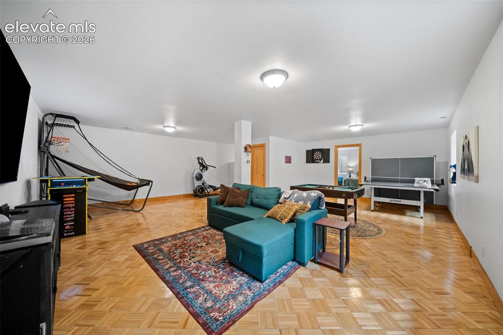 Image 19 of 39: Main level bedroom with private access to backyard patio and ensuite