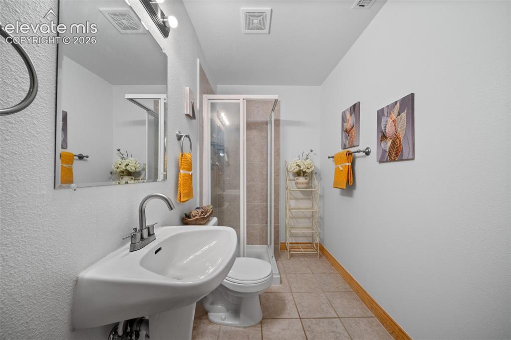 Image 24 of 39: Main level full bathroom