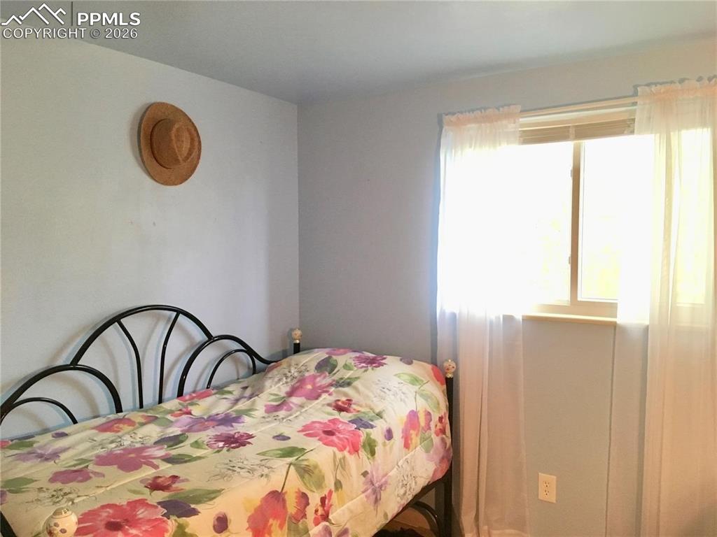 Image 19 of 33: Lower level 1/2 bath/laundry room.