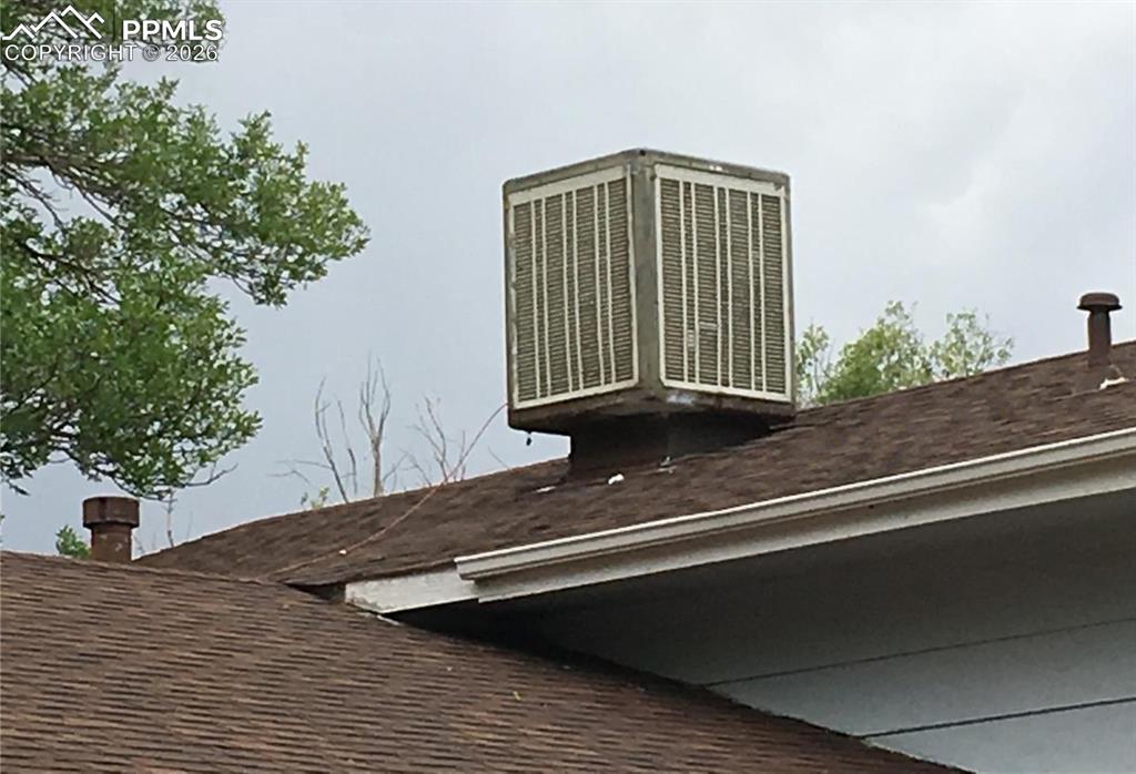 Image 32 of 33: The backyard offers several areas to relax or entertain.