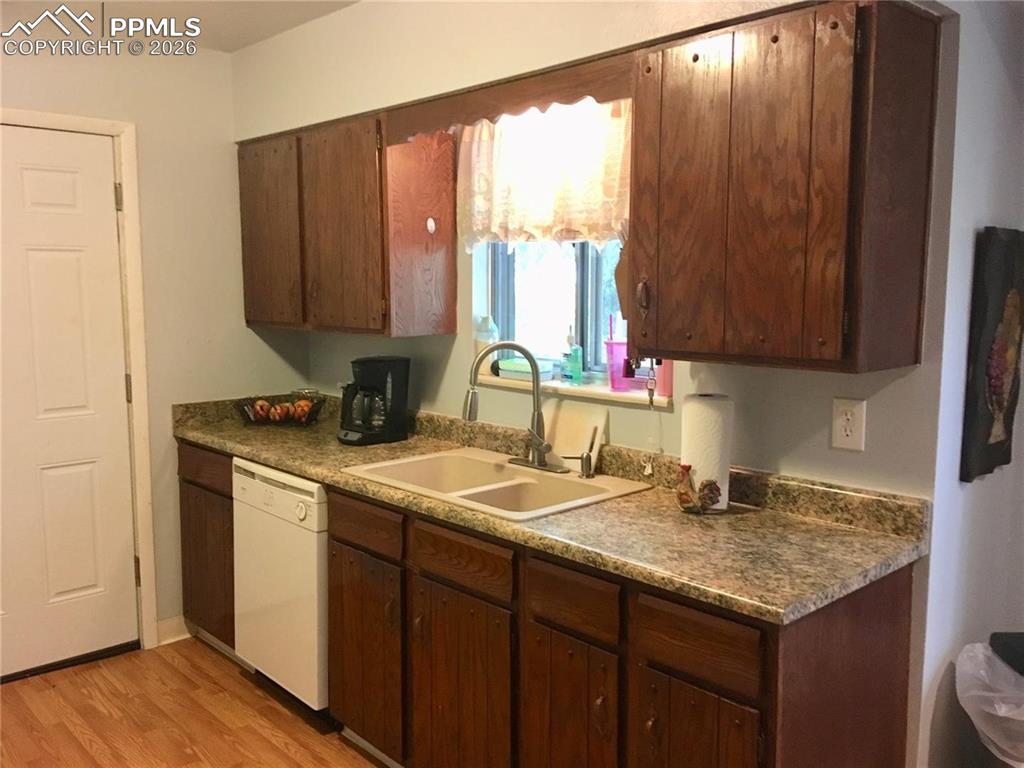 Image 7 of 33: Front entry to home flows into formal living room.