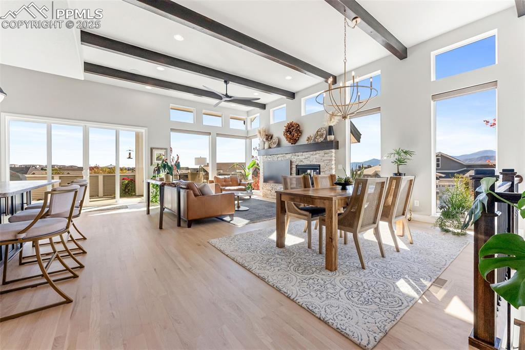 Image 11 of 50: Natural wood floors throughout the main level living area