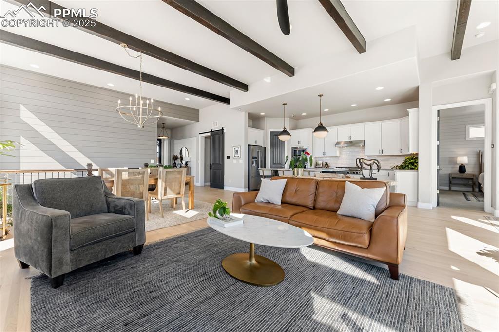 Image 13 of 50: Off the kitchen is the primary suite with adjoining primary bathroom