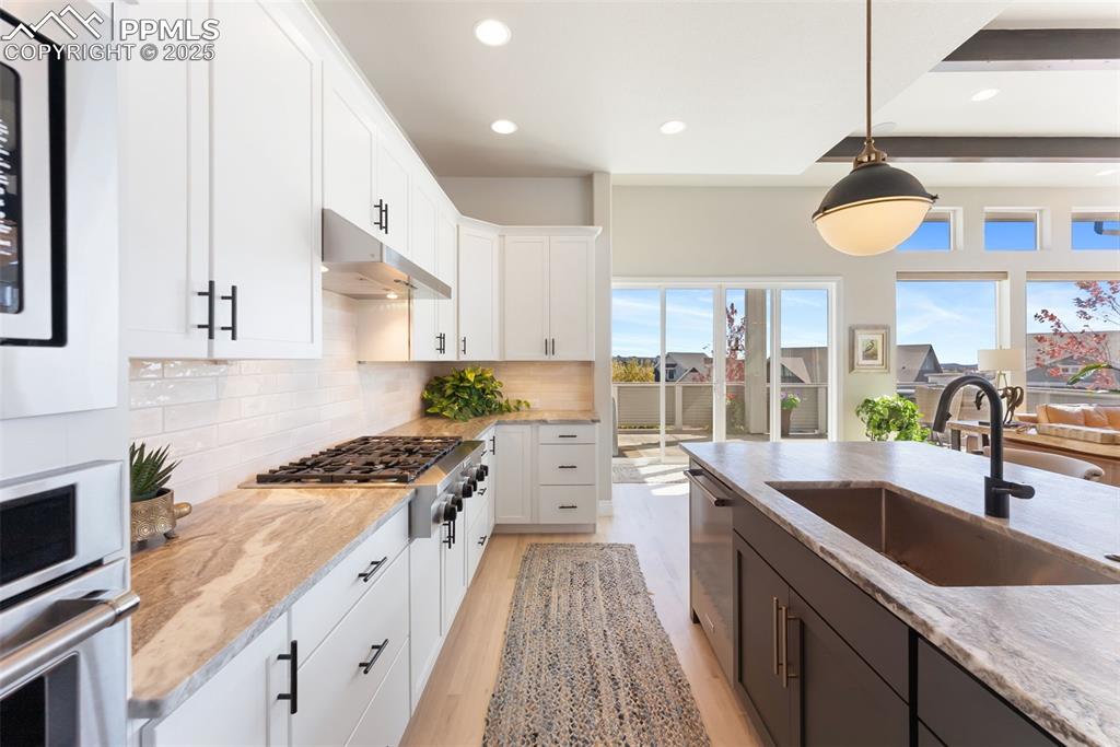 Image 17 of 50: Great amount of counter space and cabinets even have built-in under cabinet