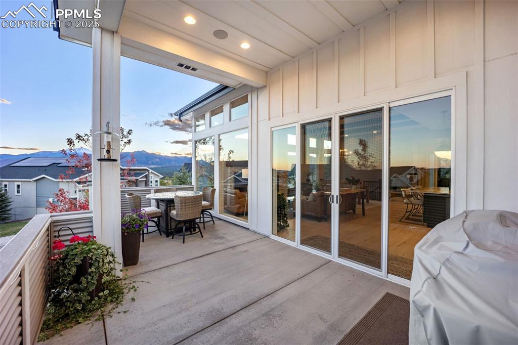Image 8 of 50: Covered patio captures the essence of Colorado living — open, peaceful, and