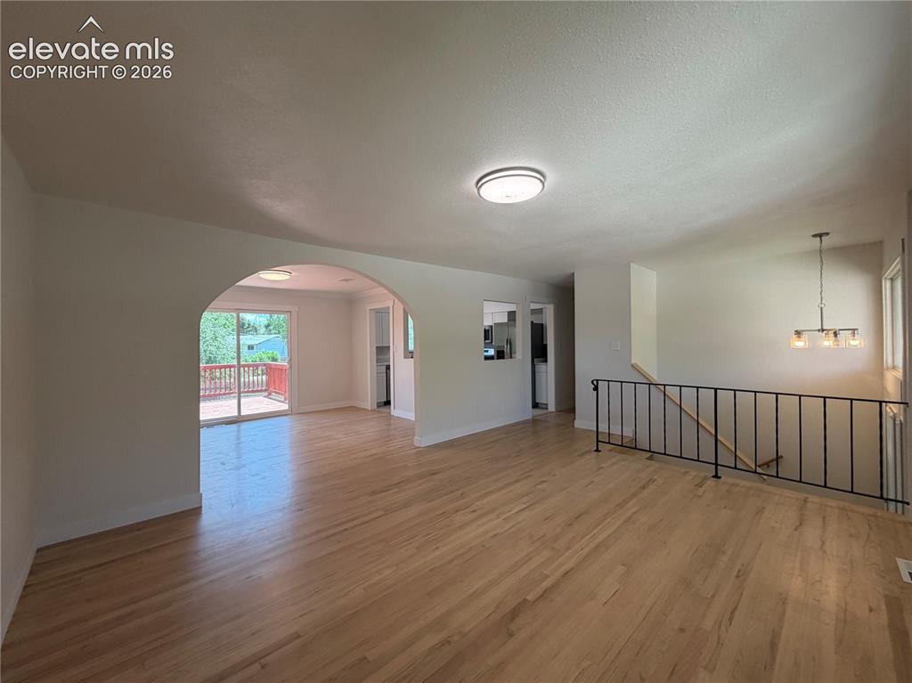 Image 4 of 27: Freshly sanded and stained hardwood floors.