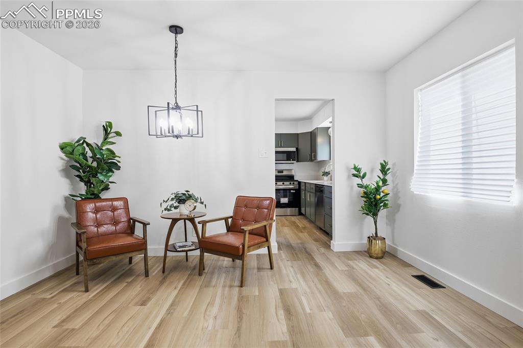 Image 3 of 44: This property features light-colored flooring, white walls, and a contempor