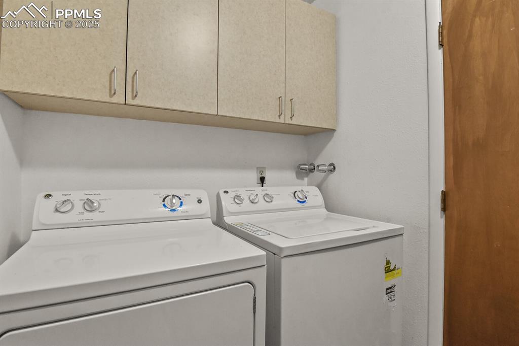 Image 17 of 35: Laundry area on upper level. Washer and dryer are included