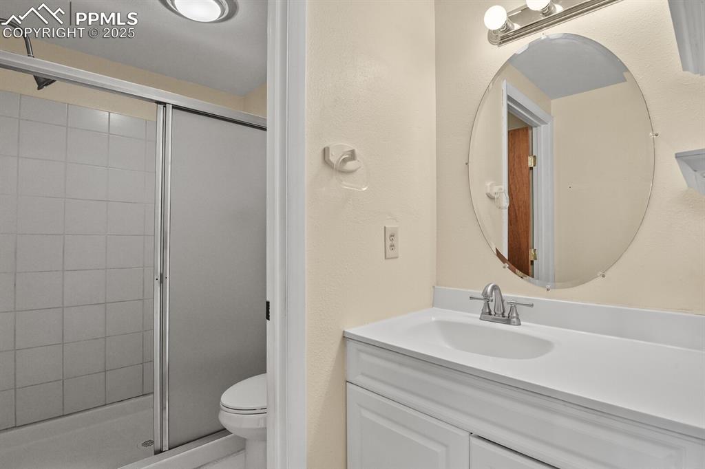 Image 22 of 35: 1st bedroom private bath
