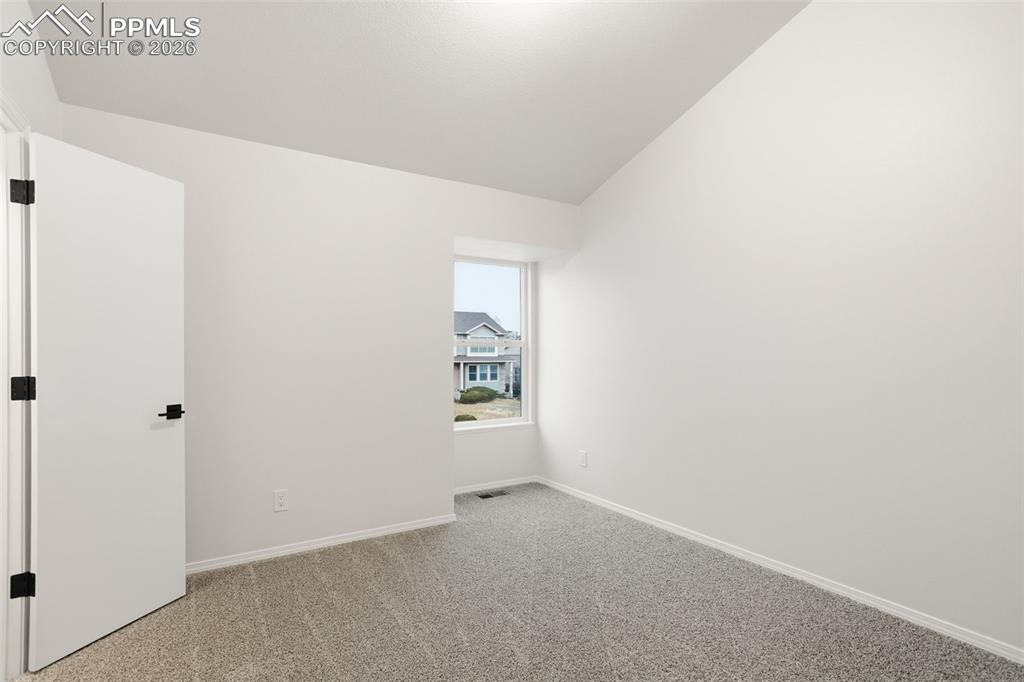 Image 31 of 46: Spacious Bedroom #2 with Vaulted Ceiling