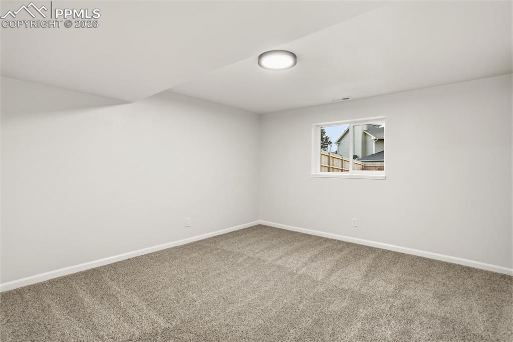 Image 42 of 46: Private Basement Bedroom, Offering Comfort and Quiet Retreat