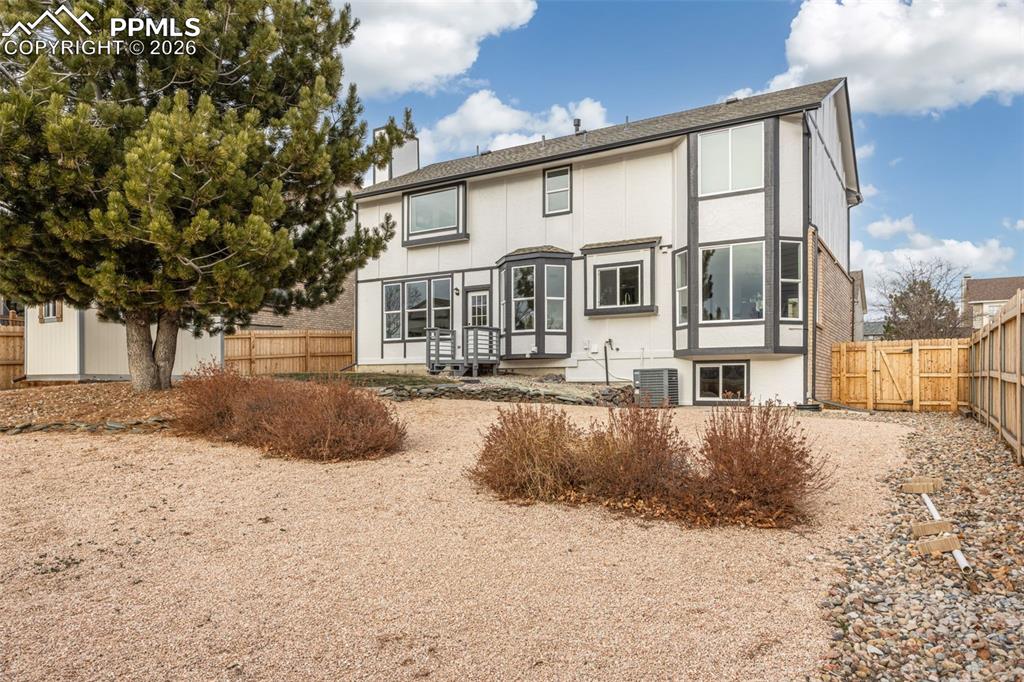 Image 44 of 46: Private Backyard with Low-Maintenance Landscaping