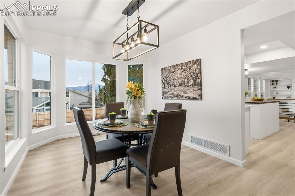 Image 9 of 46: Designer Dining Space