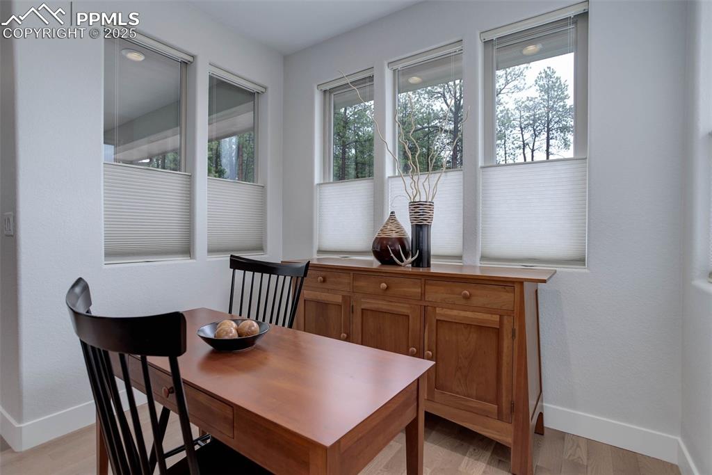 Image 10 of 28: Dining area featuring baseboards and light wood-style flooring