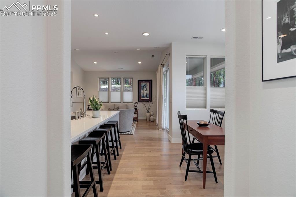 Image 4 of 28: Dining area featuring recessed lighting, light wood-type flooring, and base