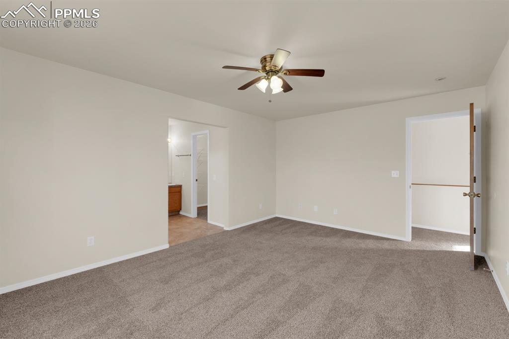 Image 15 of 41: Bedroom featuring light colored carpet and a ceiling fan