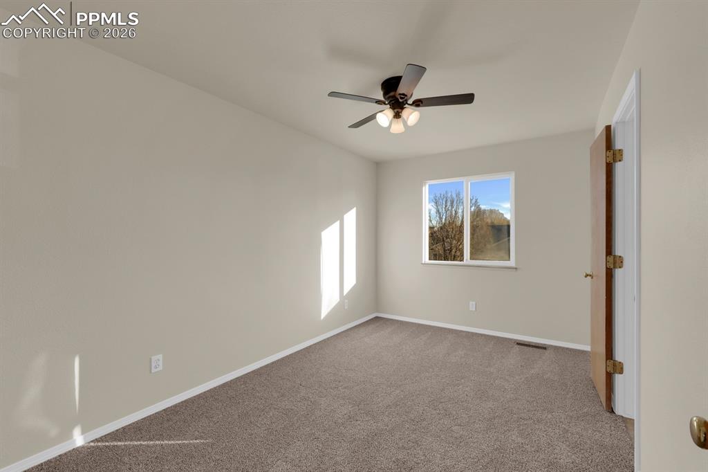 Image 19 of 41: Bedroom with carpet floors and ceiling fan