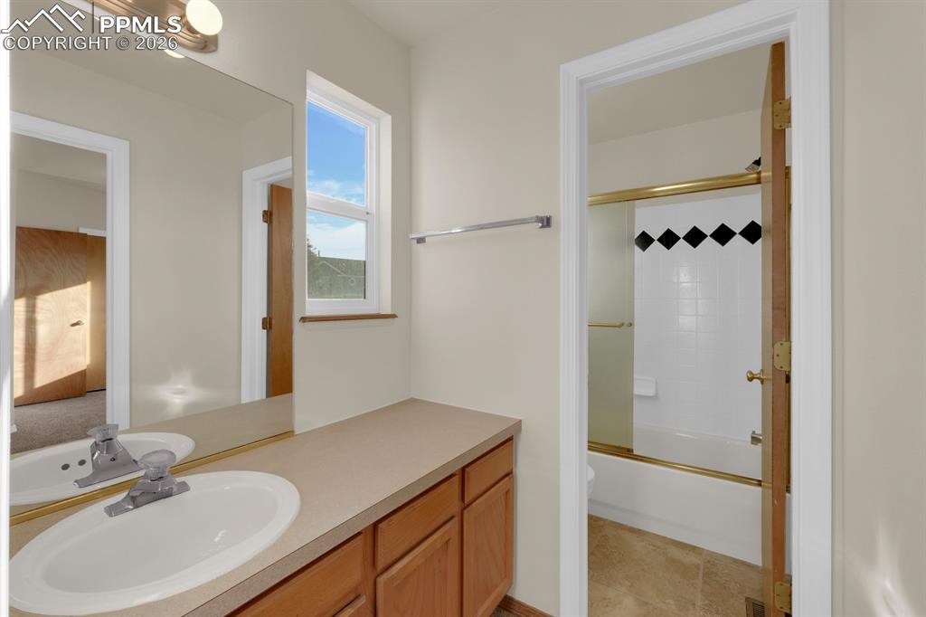 Image 21 of 41: Full bathroom with vanity