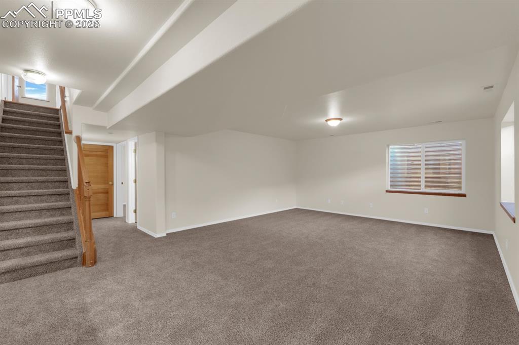 Image 24 of 41: Basement featuring new carpet