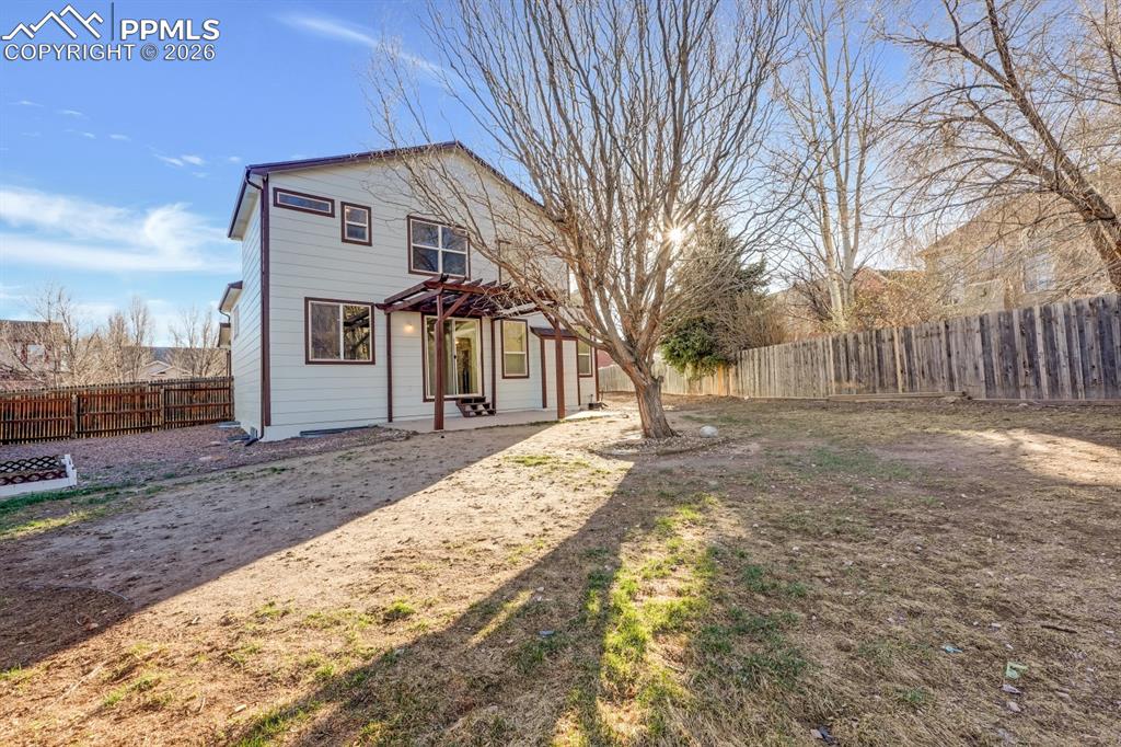 Image 29 of 41: Rear view of property with a patio and a fenced backyard