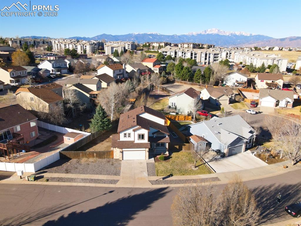 Image 34 of 41: Aerial perspective of suburban area with mountains