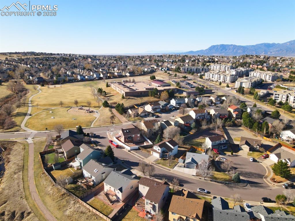 Image 35 of 41: Aerial view of residential area featuring mountains