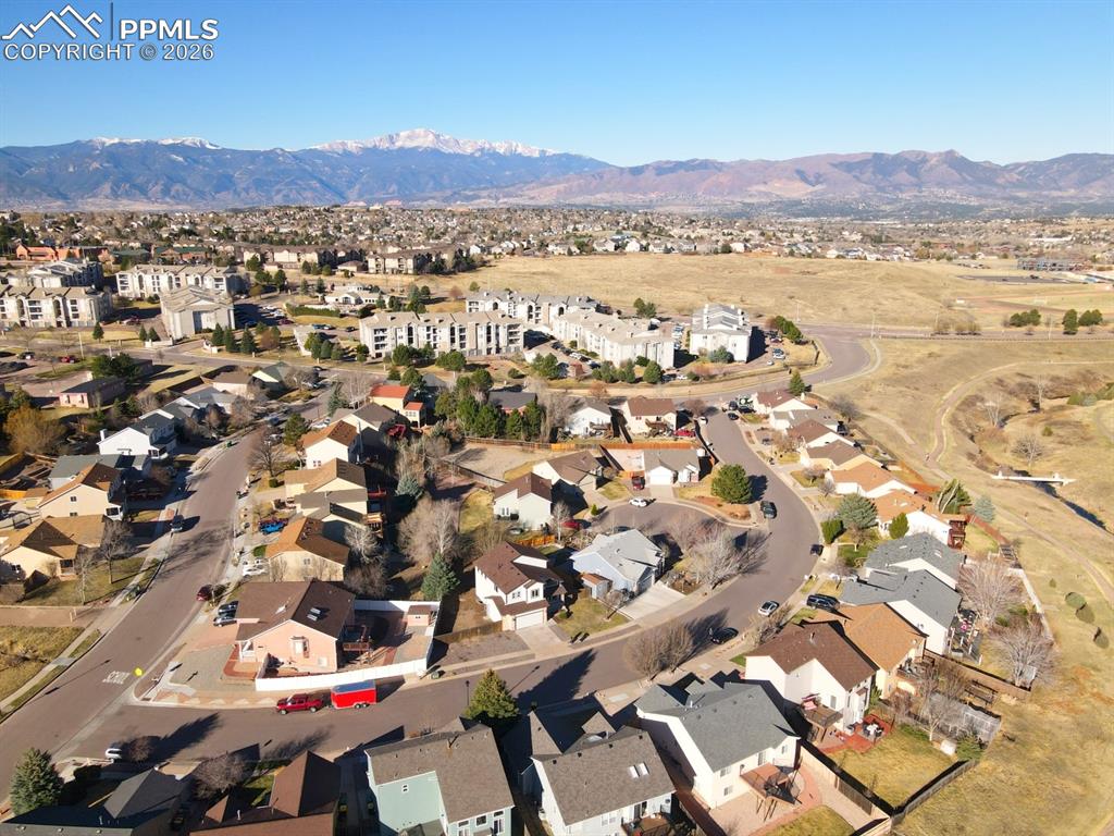 Image 36 of 41: View of property location with nearby suburban area and mountains