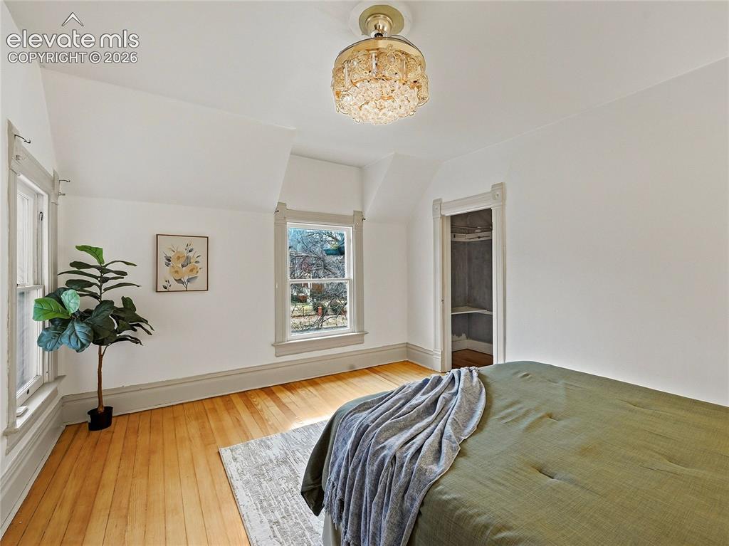 Image 18 of 33: Primary suite w/sitting room, balcony and walk-in closet.