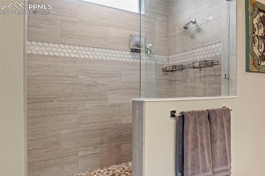 Image 17 of 38: Full bathroom featuring walk in shower