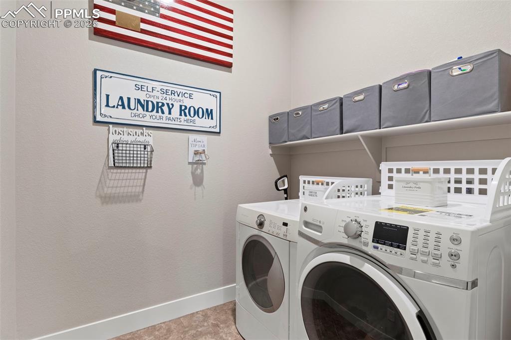 Image 29 of 38: Laundry area with independent washer and dryer, laundry area, and baseboard
