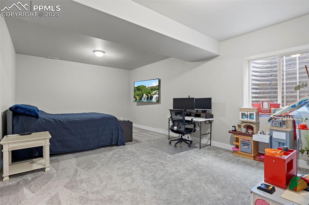 Image 30 of 38: Carpeted bedroom featuring visible vents and baseboards