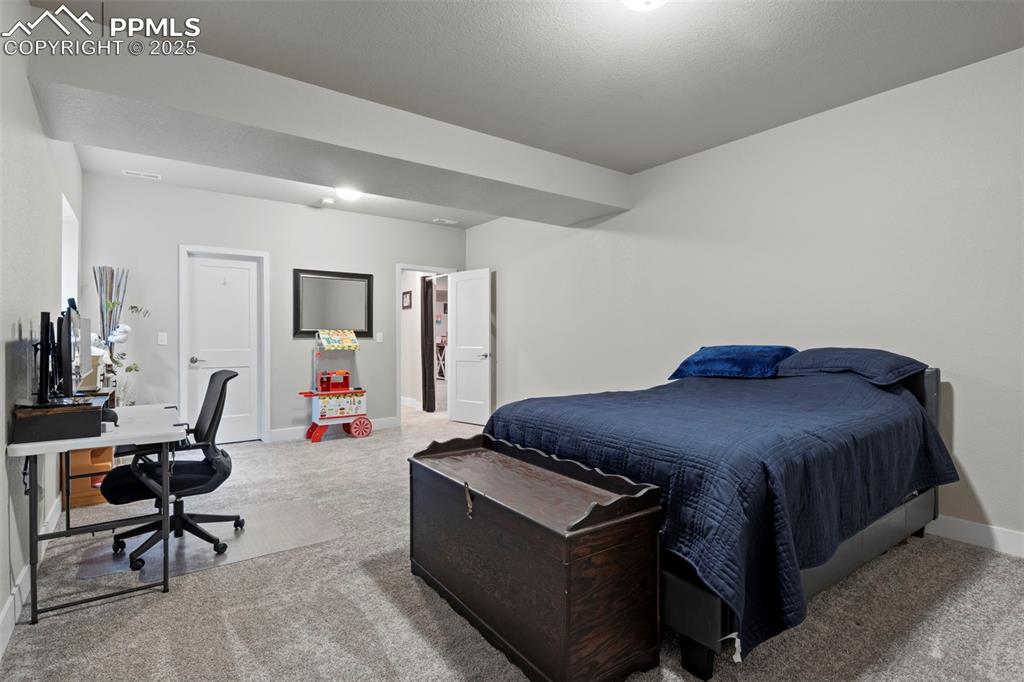 Image 31 of 38: Bedroom featuring visible vents, baseboards, and carpet floors