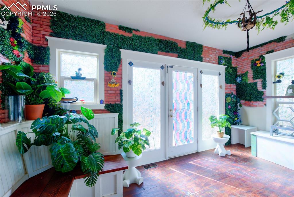 Image 10 of 33: Bonus room / mud room to back yard