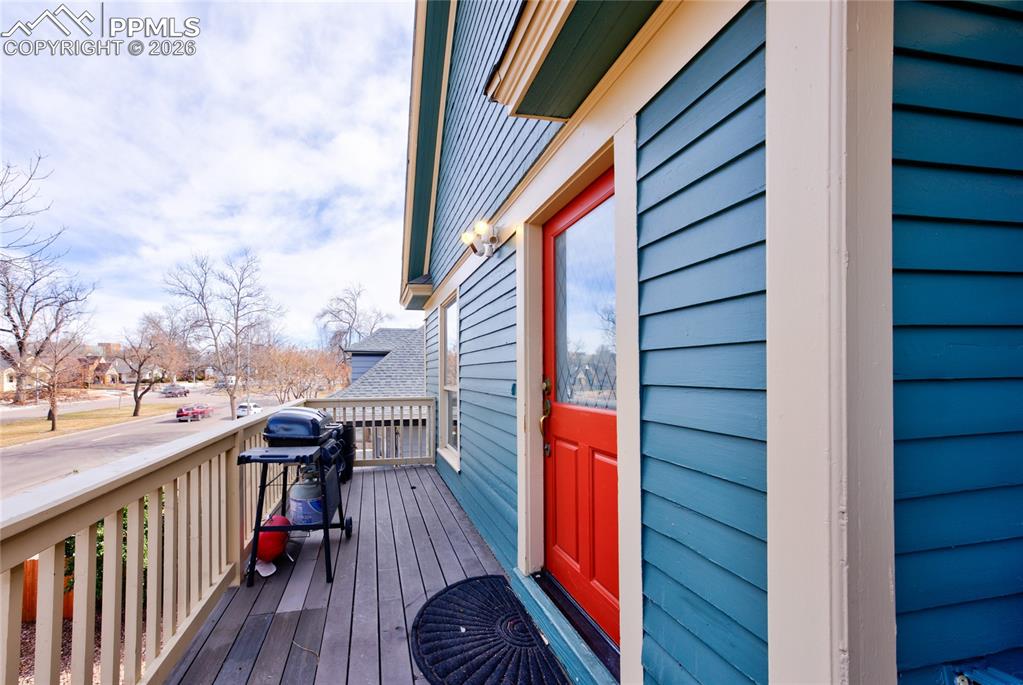 Image 16 of 33: Front door to upper unit