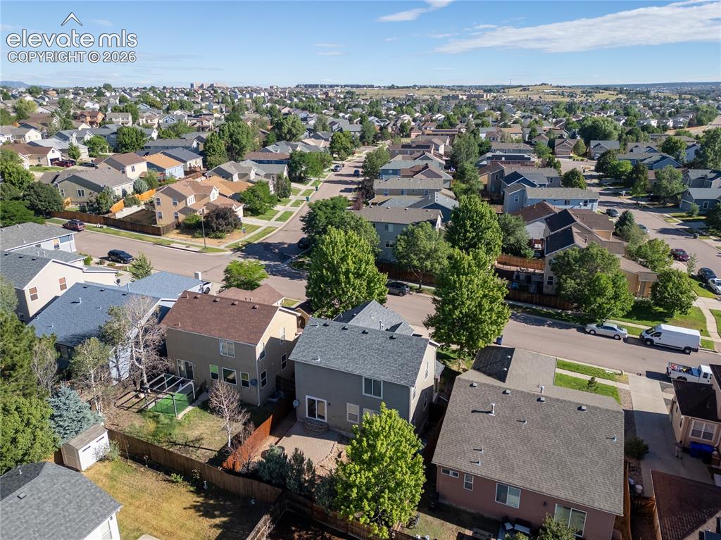 Image 33 of 39: Aerial perspective showcasing a residential area with varied home styles an